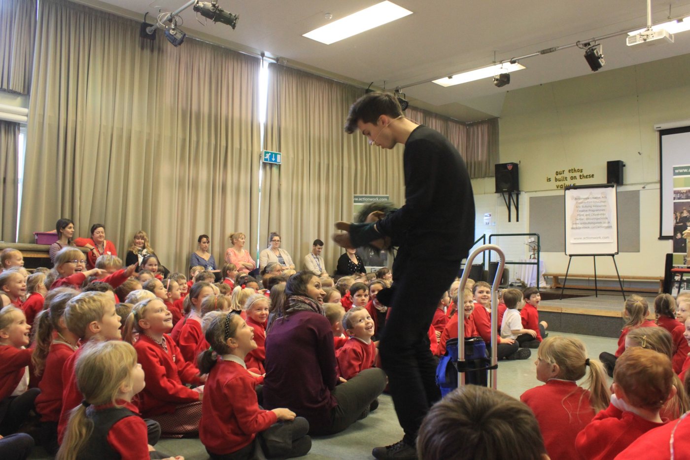 Young people taking part in an interactive creative workshop