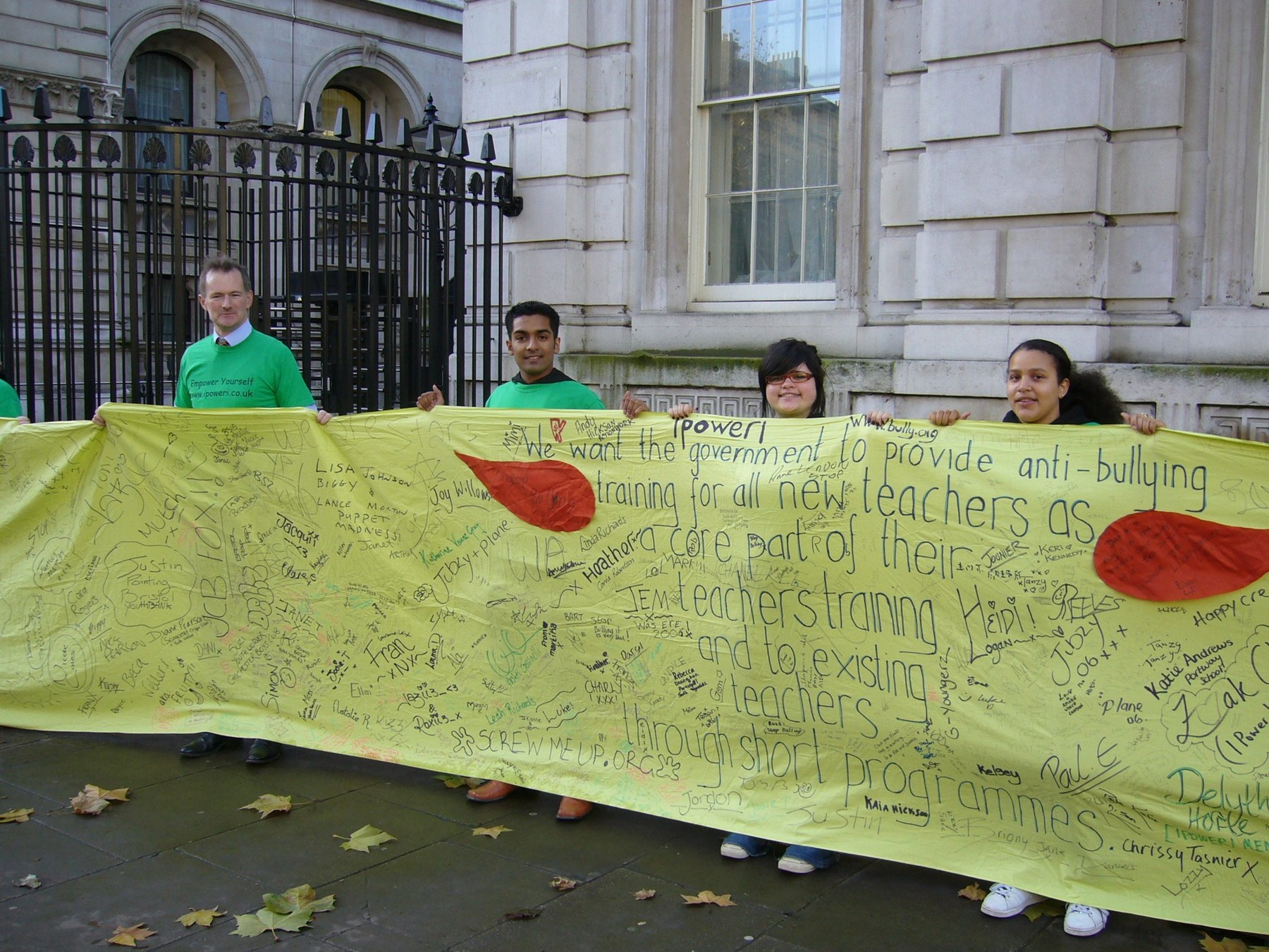 Young people holding a signed anti bullying banner outside Downing Street shortly before handing it to Tony Blair