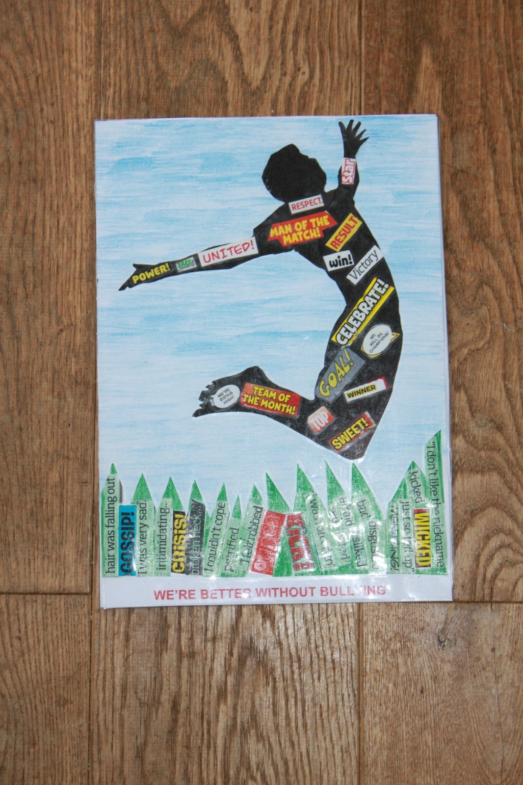 Competition artwork showing a silhouetted jumping figure made from cut out words, with the message We are Better Without Bullying